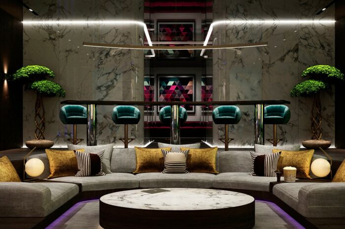 This sunken cinema seating area and the bar stools behind can accommodate up to 14 people.